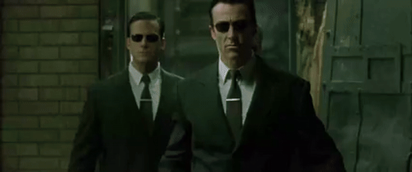Matrix Reloaded opening scene. Neo greets 3 entering agents with "Hiya fellas".